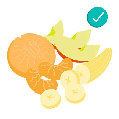 A bowl of fresh apples, oranges, and bananas, safe fruits for dogs in moderation with proper preparation
