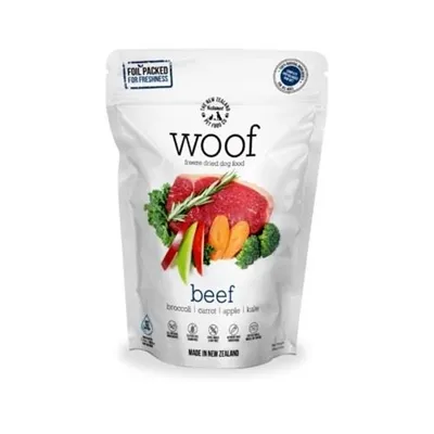 A bowl of Woof freeze-dried dog food, partially rehydrated with water.