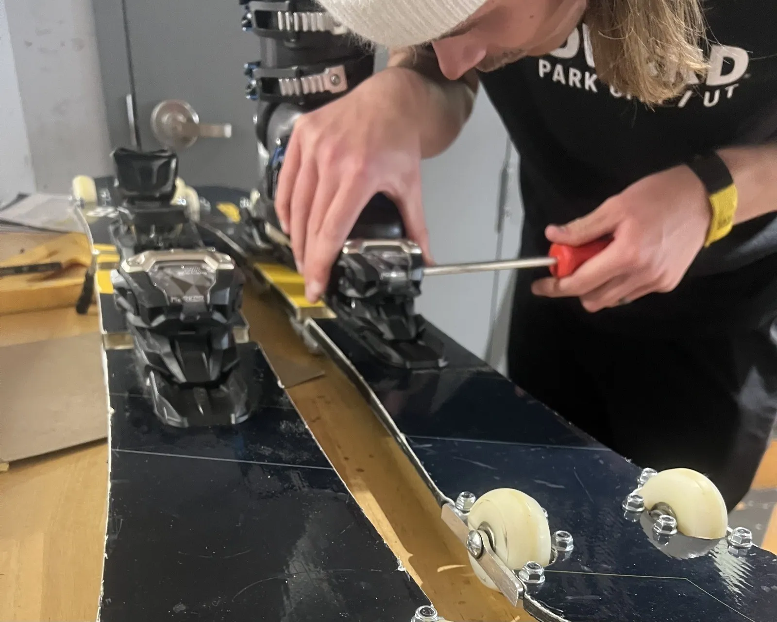 A cheerful senior dog with its owner demonstrating a basic training command, reflecting progress and determination.