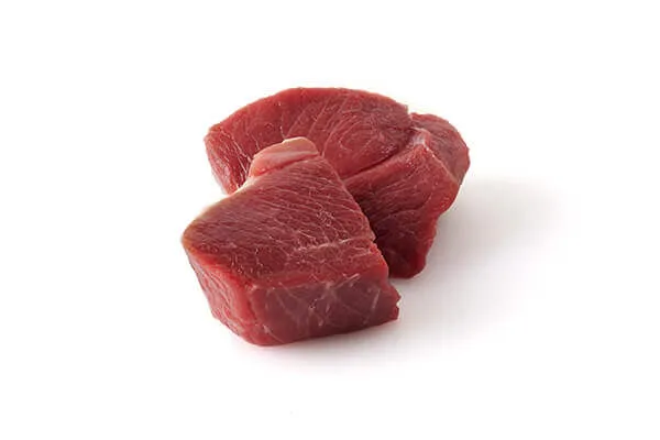 A close-up image of fresh, lean lamb meat, highlighting its quality as a protein source for dog food.