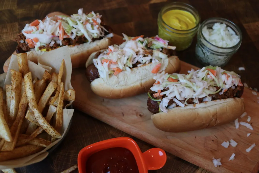 A close-up of a West Virginia Slaw Dog showing the chili and slaw