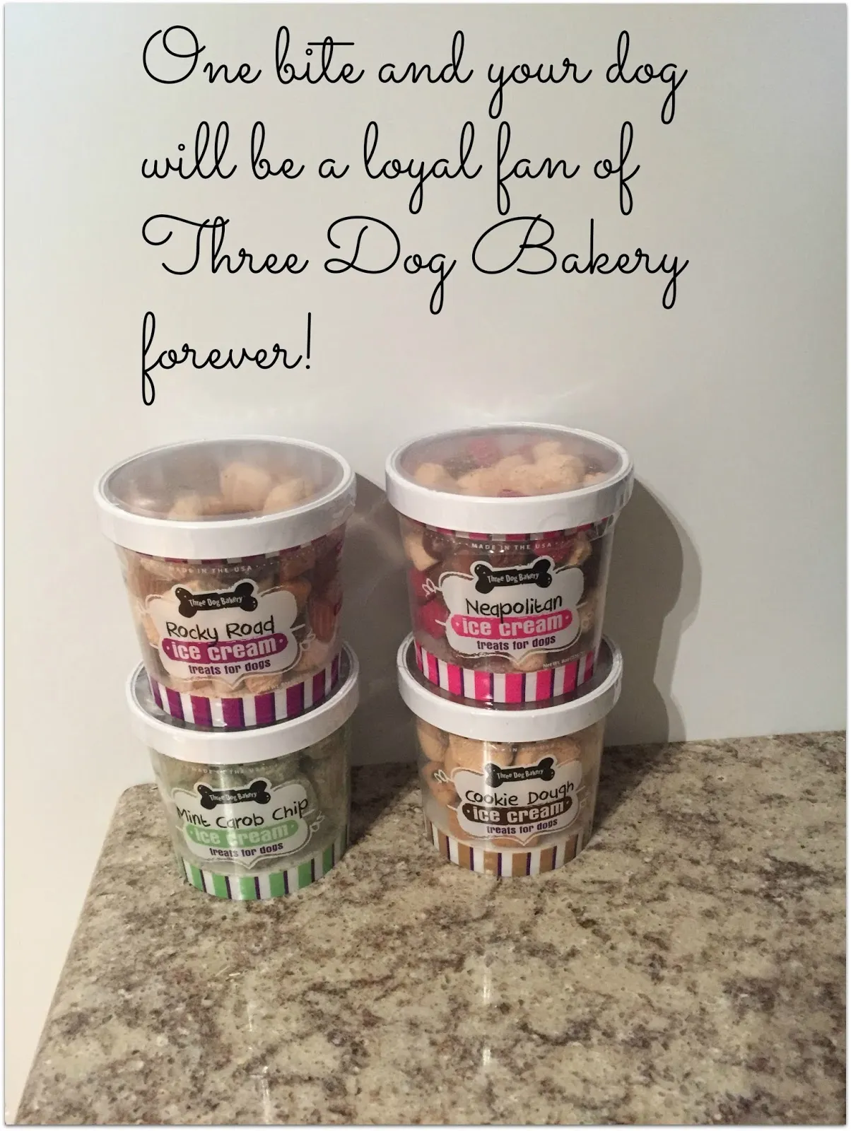 A close-up of various dog treats from Three Dog Bakery, showcasing their appealing shapes and colors.