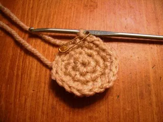 A detailed crocheted Yorkie head, showcasing the stitches and shaping