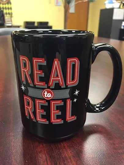 A dog sitting with a book titled 'A Dog's Purpose', looking content