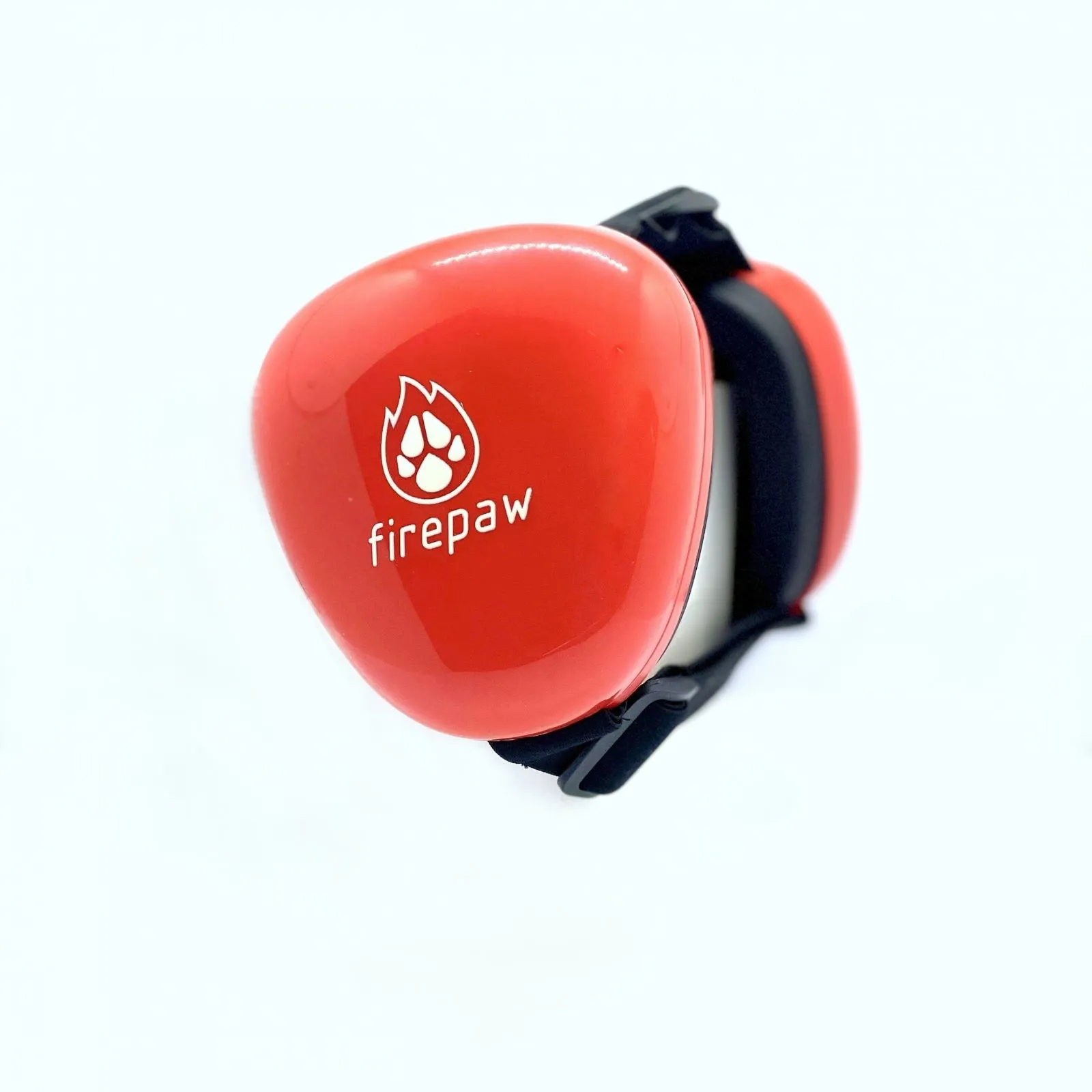 A dog wearing ear muffs in a snowy environment