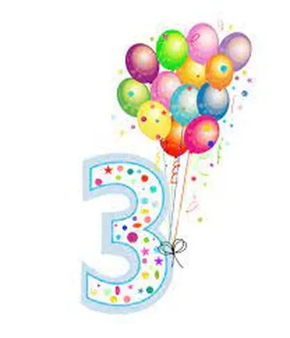 A Labradoodle named Rufus celebrating his third birthday, looking happy and playful.