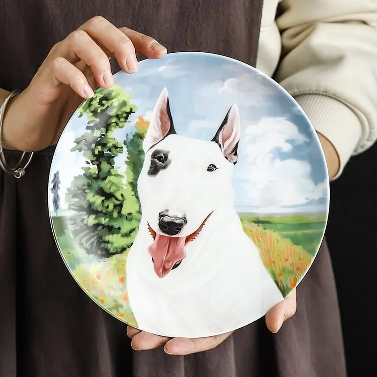 A lady holding a Bull Terrier plate made of bone china in a beautiful Bull Terrier print.