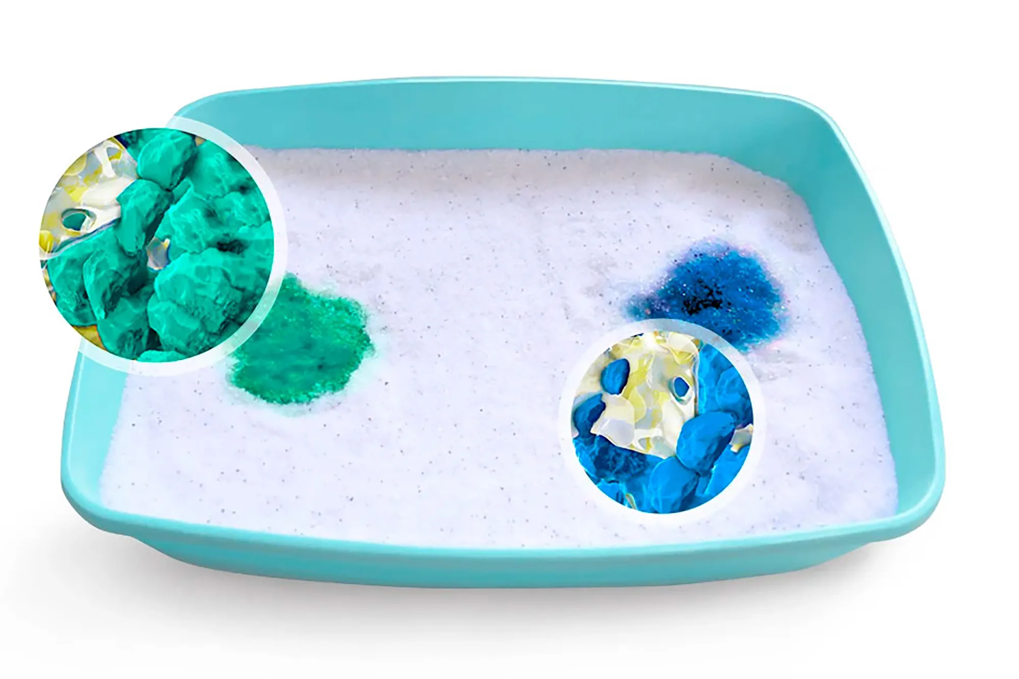 A litter box with a green spot and a blue spot