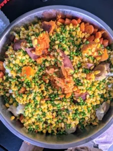 A mix of peas, carrots, corn, potatoes, and squash providing dietary fiber, vitamins, and antioxidants for healthy dog food.