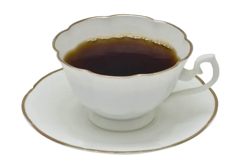 A mug of coffee, dangerous for dogs due to its high caffeine content, affecting the heart and nervous system.