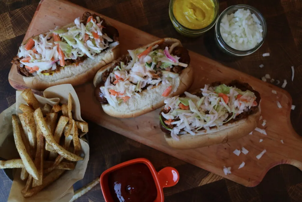 A perfectly dressed West Virginia Slaw Dog in a bun with chili and coleslaw