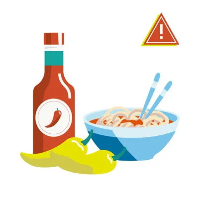 A red chili pepper, symbolizing spicy foods that dogs should avoid.