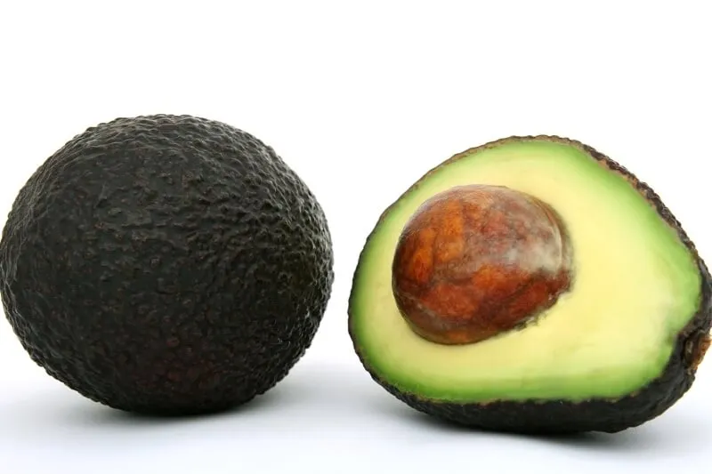 A sliced avocado, containing persin which is harmful to dogs.