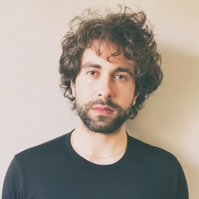 A thoughtful professional considering ethical pet care and sourcing healthy toy poodles for sale