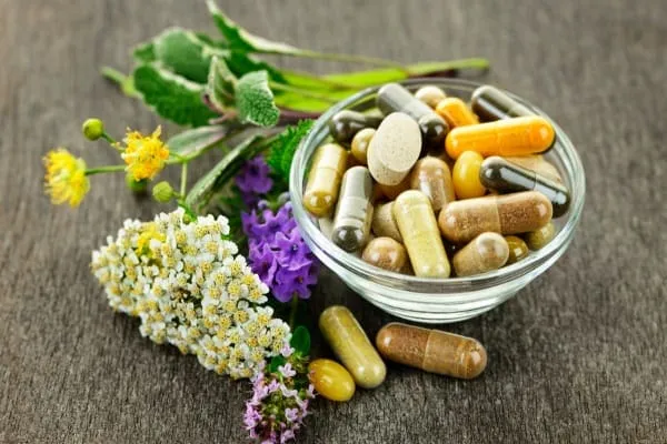 A variety of supplements in a bowl