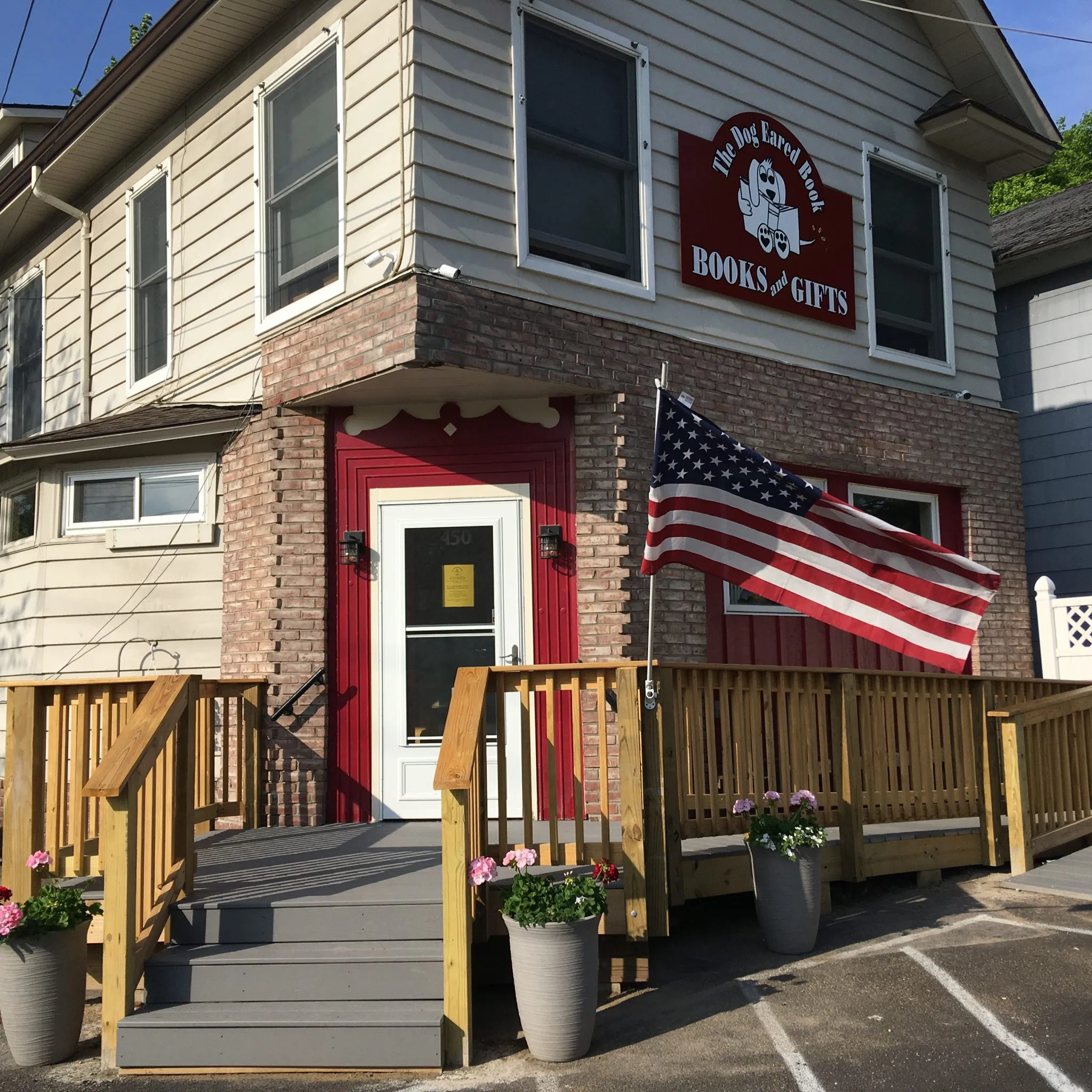 A welcoming interior view of The Dog Eared Book shop with shelves filled with diverse books