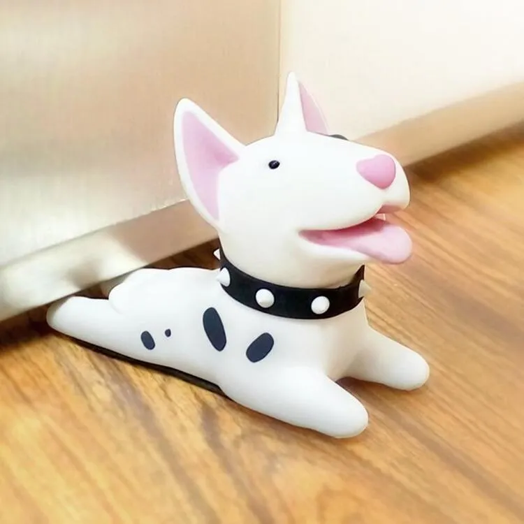 A white Bull Terrier door stopper on a wooden floor.