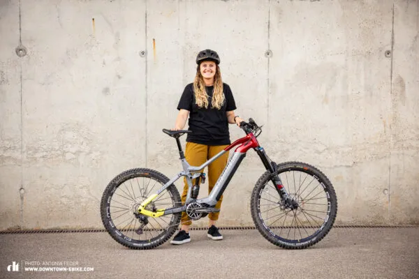 Antonia, an avid cyclist, prepares her bike trailer for an off-road adventure with her dog.