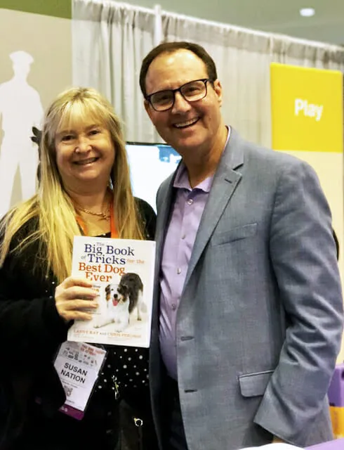 Author Larry Kay with reviewer Susan Nation, discussing the best dog trick training book