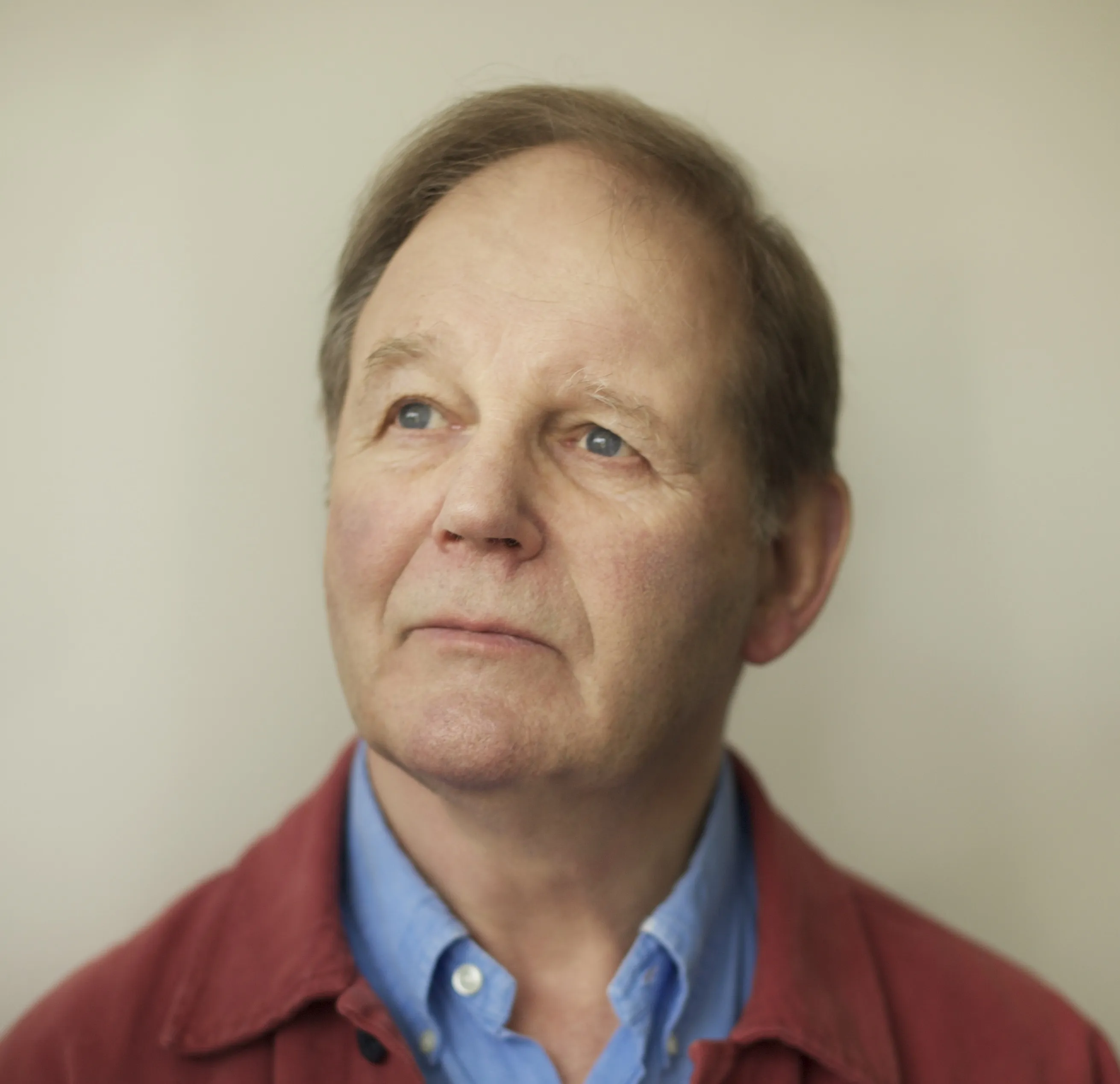 Author Michael Morpurgo engaging with a dog, reflecting his deep love for animals and inspiration for his many popular dog books.