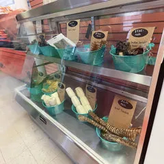 Bulk dog treats and chews displayed in a pet care business, illustrating how to buy dog supplies in bulk for resale and customer convenience.