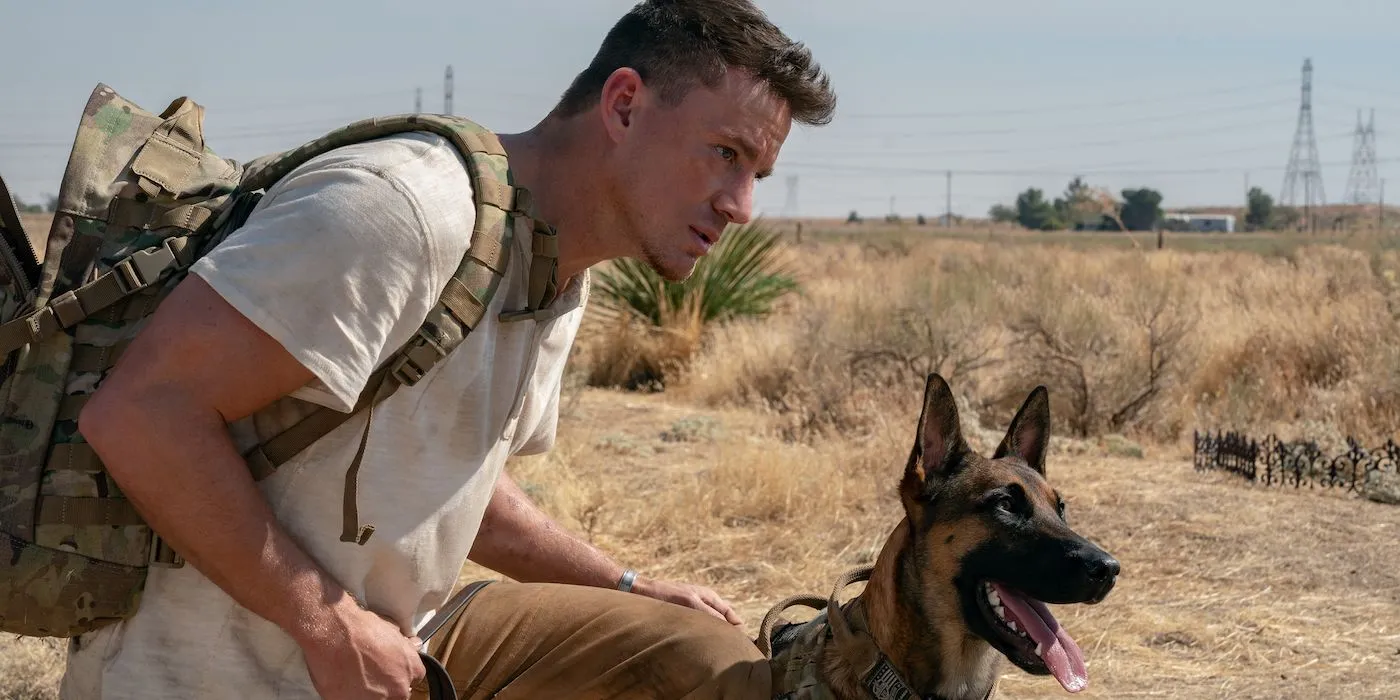 Channing Tatum's Jackson and Lulu the military dog looking intently at an unseen object in "Dog" (2022), highlighting the challenge of directing canine actors.