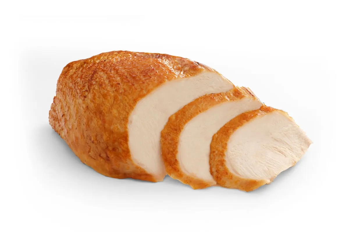 Close-up of cooked deboned turkey, a primary protein source in BLUE Basics Turkey and Potato Small Breed formula.