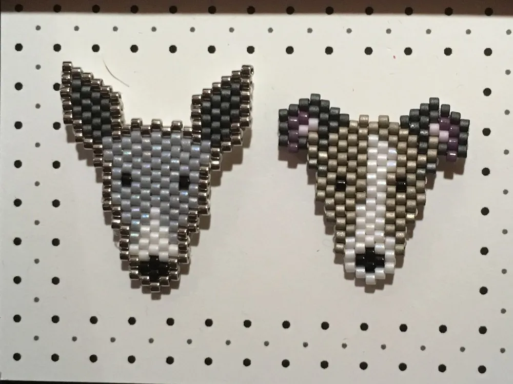 Close-up of Little Charm Store enamel pins