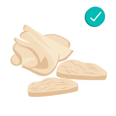Cooked turkey meat slices, indicating lean, boneless turkey is safe for dogs