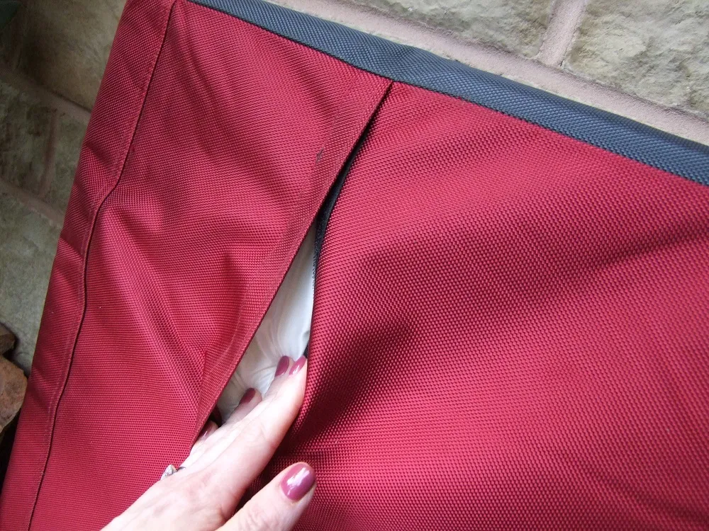 Demonstrating the removable foam core from the Scruffs durable dog bed