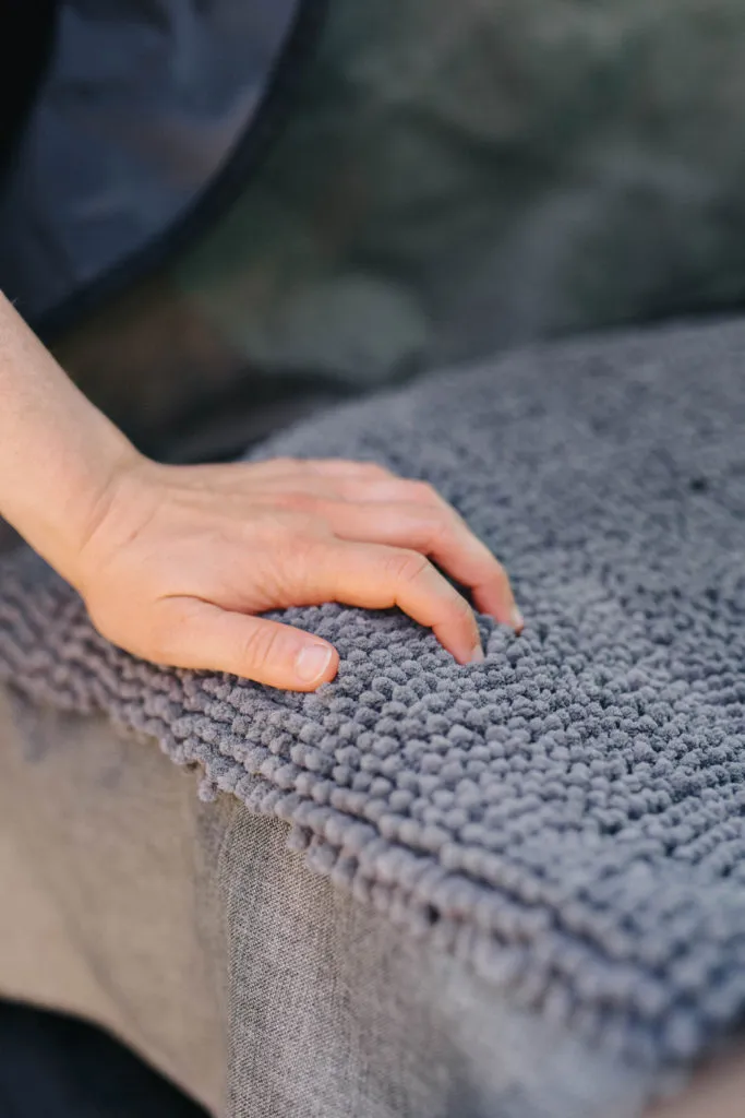 Detailed view of the absorbent Dirty Dog microfiber material on the DGS Pet car seat cover, emphasizing its plush quality.