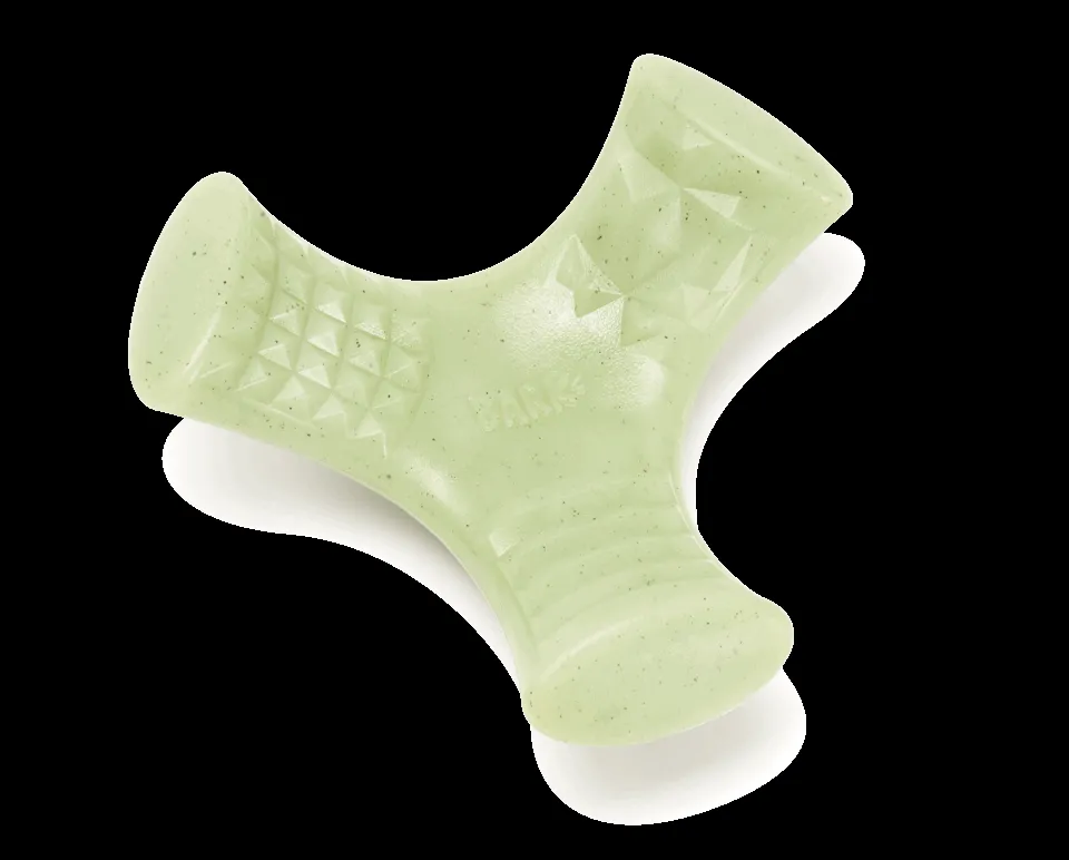 Dog chewing on a Super Chewer "Chopper" chew toy