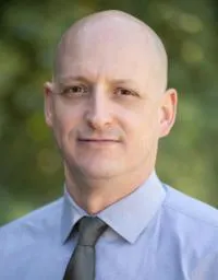 Dog getting teeth brushed at home