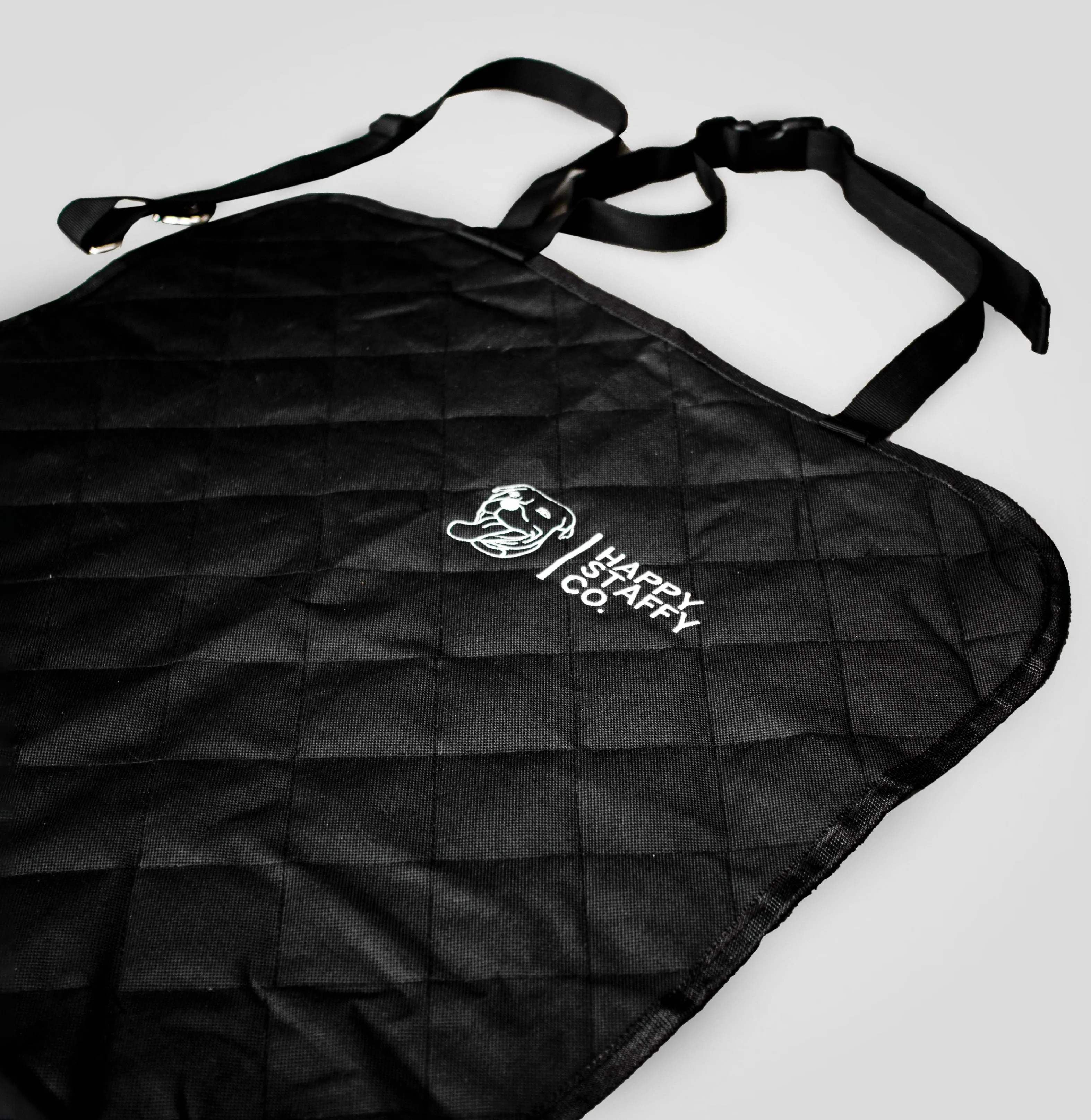 Dog looking out of car window in a single seat cover