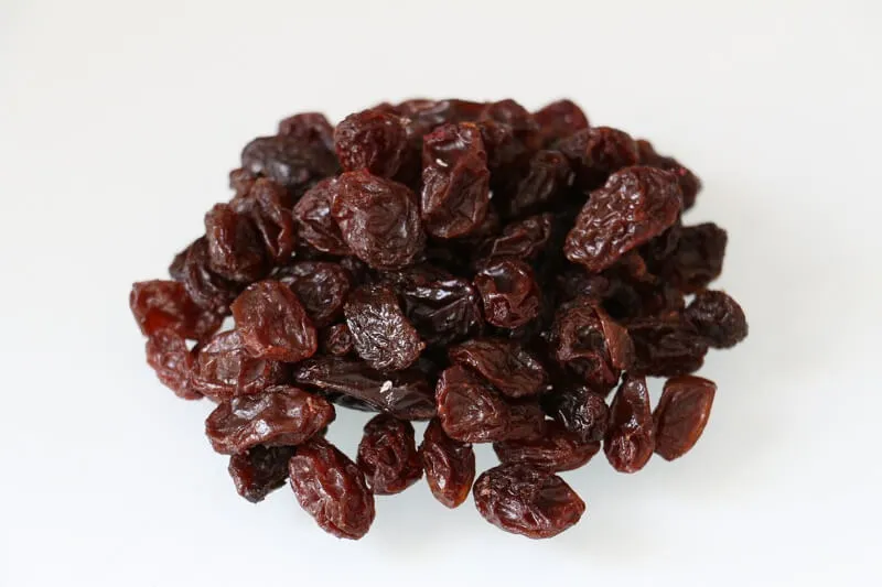 Dried raisins, just as harmful to dogs as fresh grapes.
