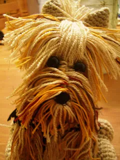 Front view of a finished crocheted Amigurumi Teacup Yorkie, featuring button eyes and a hand-stitched nose.