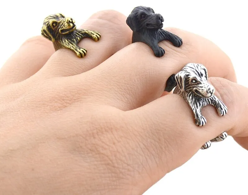 Image of three finger wrap Golden Retriever rings in the color antique silver, antique bronze, and black gun