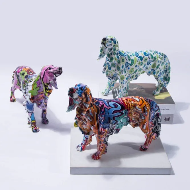 Image of three multicolor Golden Retriever statues in different color blends and made of resin