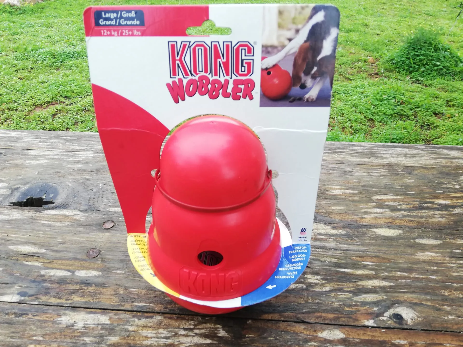 Kong Wobbler Interactive Treat Dispensing Dog Toy, red, with a wide base