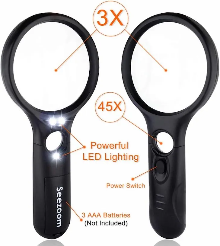 Lighted magnifying glass for examining pet injuries like cuts or splinters