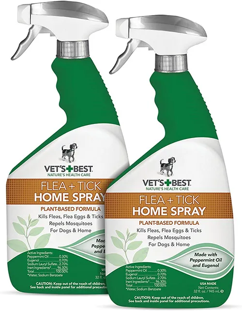 Natural flea and tick spray being applied to a dog's fur