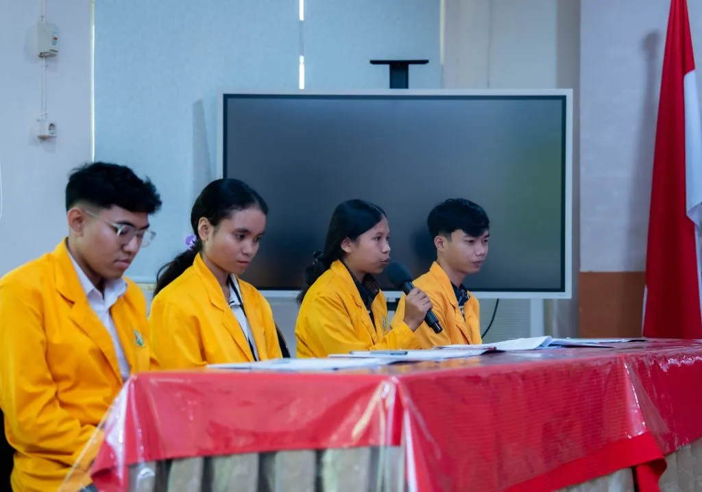 One of the deserving students being presented with their Radhiyan Pet Care scholarship bond.