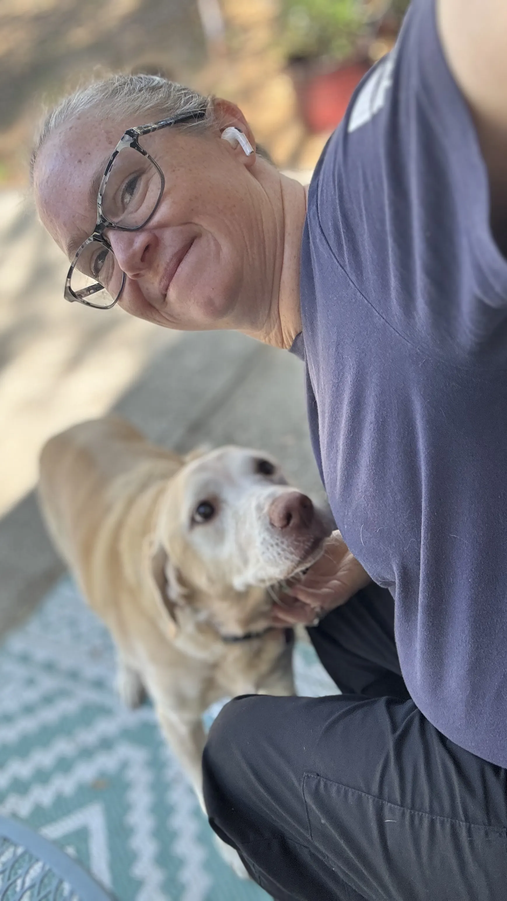 Professional dog sitter interacting with a happy dog in Tampa home