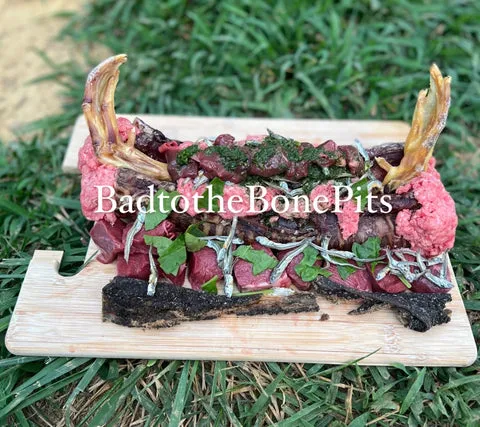 Raw beef trachea and tripe meal with vegetables, duck feet, and anchovies for Pitbull