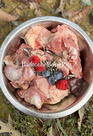 Raw chicken gizzards, chicken backs, anchovies, blueberries, raspberries, and calf liver for a Pitbull's diet