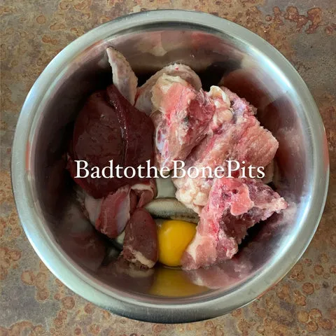 Raw chicken leg quarter meal for Pitbull with chicken organs and sardines