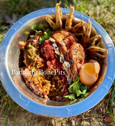 Raw chicken mix meal for Pitbull with whole egg, seafood, and spring greens