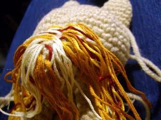 Real Yorkshire Terrier standing outdoors, looking alert and playful, showcasing its distinctive coat and small size.