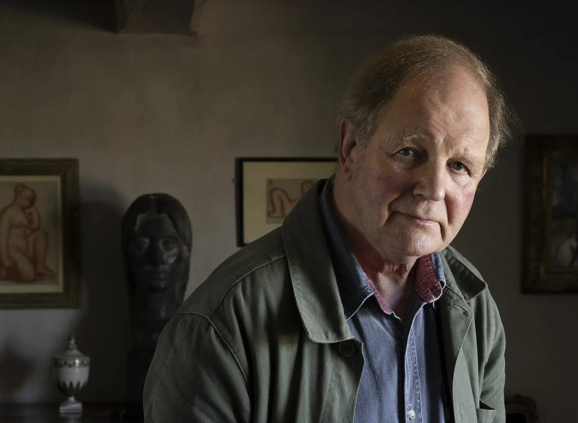Renowned author Sir Michael Morpurgo, known for his beloved dog books like Cobweb and War Horse, smiling during a portrait session.