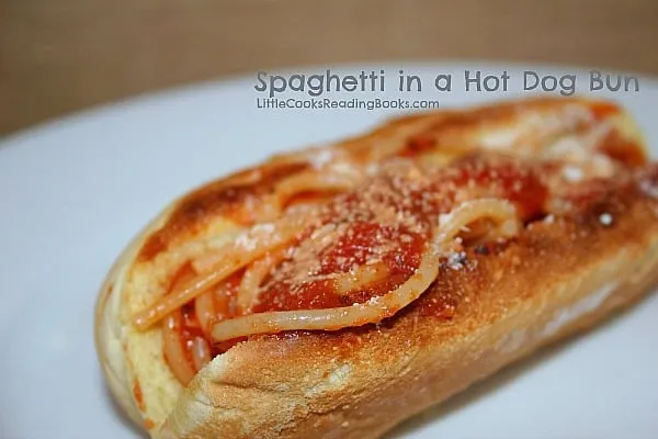 Spaghetti In A Hot Dog Bun on a white plate